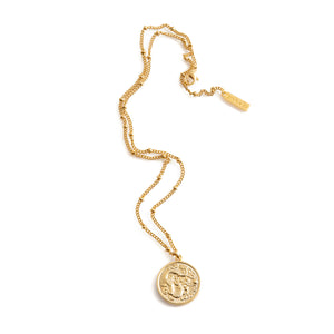 Long gold necklace with large snake pendant